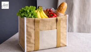 A sturdy jute-style tote bag filled with fresh bread and vegetables, highlighting eco-friendly options from handmade tote bag manufacturers.