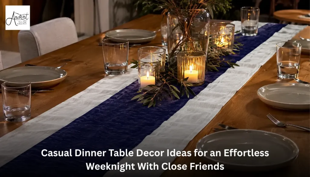 Cohesive casual dinner table decor ideas highlighted by a narrow maroon runner over a wide cream fabric base, accented with white flower vases and lit tea candles.