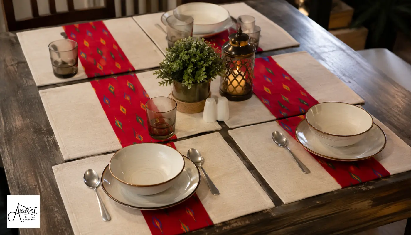 Best canvas table mats with red ikat printed accents on a rustic wooden dining table setting.
